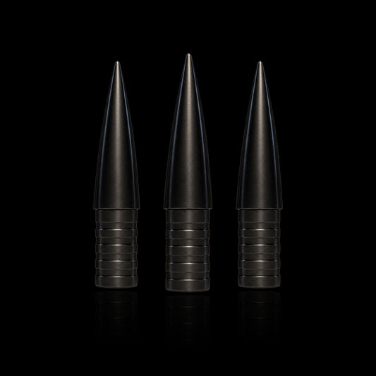 Three Competition Archery Products 3D NockBuster Ballistic arrow points upright on black